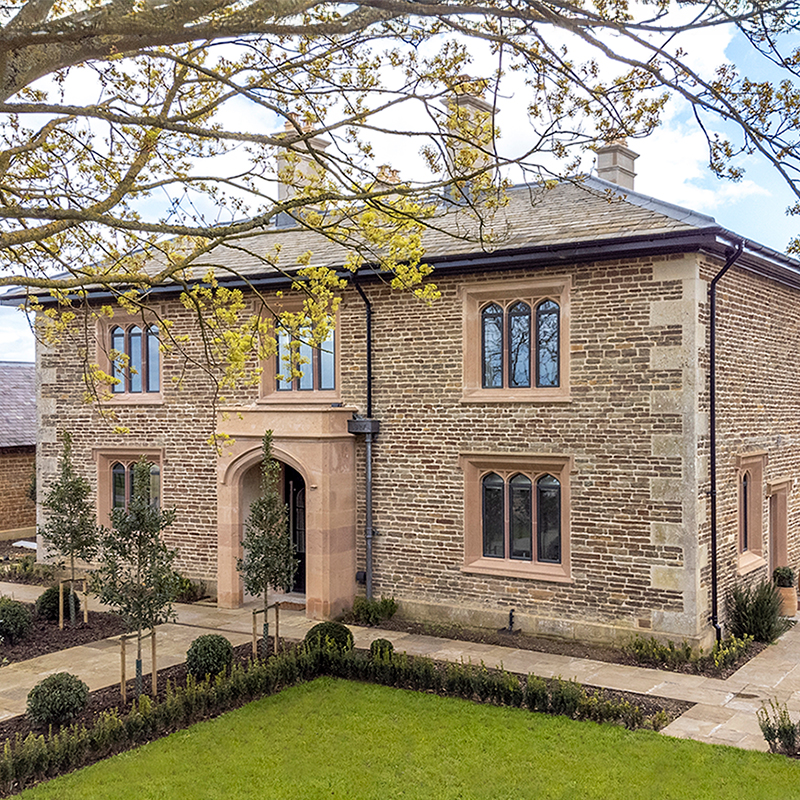 House with bronze windows