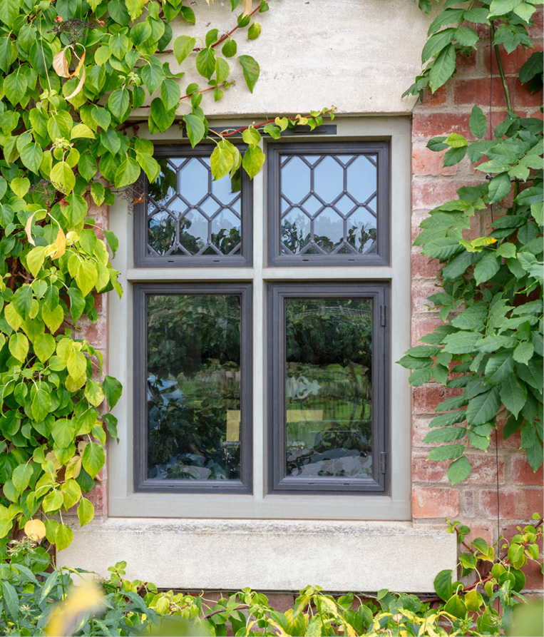 close up of bronze windows with decorative top panel