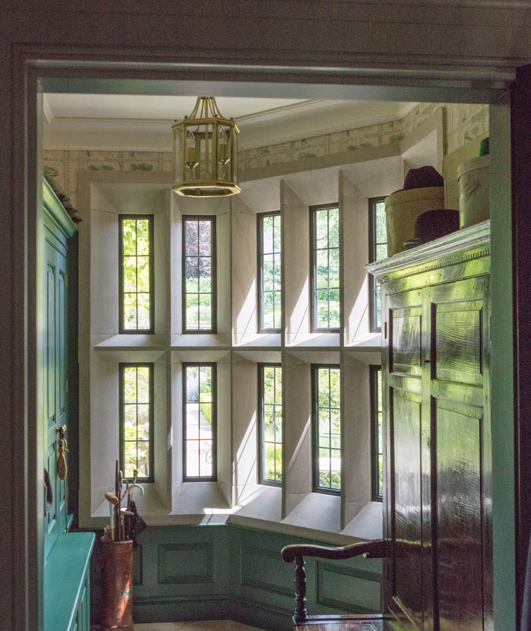 Cloakroom with Bronze Windows Set in Stone Mullions