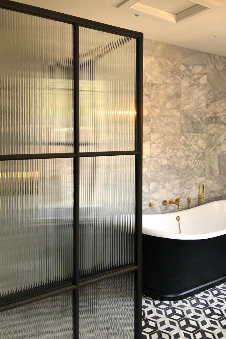 Frosted Glass Set in a Bronze Window in a Bathroom