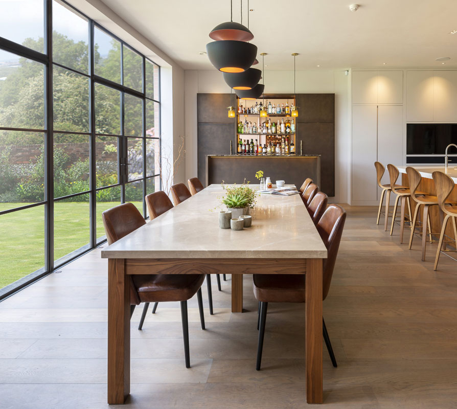 kitchen designed with bronze screen out to the garden